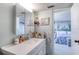 Bathroom with vanity and view of bedroom at 925 N Halifax Ave # 1001, Daytona Beach, FL 32118