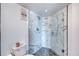 Modern bathroom with a large glass shower and marble tile at 925 N Halifax Ave # 1001, Daytona Beach, FL 32118