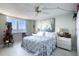 Bright bedroom with water view and floral bedding at 925 N Halifax Ave # 1001, Daytona Beach, FL 32118