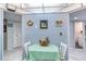 Small breakfast nook with striped wallpaper and a table for two at 925 N Halifax Ave # 1001, Daytona Beach, FL 32118