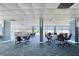 Spacious community room with multiple tables and chairs at 925 N Halifax Ave # 1001, Daytona Beach, FL 32118