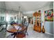 Elegant dining room with oval table, chandelier, and display cabinet at 925 N Halifax Ave # 1001, Daytona Beach, FL 32118
