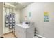 Well-lit shared laundry room with multiple washers and dryers at 925 N Halifax Ave # 1001, Daytona Beach, FL 32118