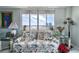 Living room with floral sofa, large windows, and stunning city view at 925 N Halifax Ave # 1001, Daytona Beach, FL 32118