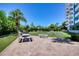 Outdoor recreation area with grills and shuffleboard at 925 N Halifax Ave # 1001, Daytona Beach, FL 32118
