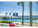 Community pool with seating and water views at 925 N Halifax Ave # 1001, Daytona Beach, FL 32118