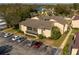 Aerial view showcasing building and parking lot at 100 E Kentucky Ave # K106, Deland, FL 32724