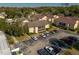 Aerial view of community and building with parking at 100 E Kentucky Ave # K106, Deland, FL 32724