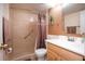 Bathroom features shower/tub combo, vanity, and toilet at 100 E Kentucky Ave # K106, Deland, FL 32724