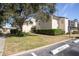 Building exterior showcasing landscaping at 100 E Kentucky Ave # K106, Deland, FL 32724