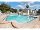 Relaxing community pool area with lounge chairs at 100 E Kentucky Ave # K106, Deland, FL 32724