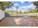 Tennis and basketball courts with chain-link fence at 100 E Kentucky Ave # K106, Deland, FL 32724