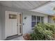 Modern front entrance with a white door and updated landscaping at 1006 Martin St, New Smyrna Beach, FL 32168