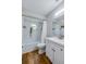 Bathroom with white vanity, tub, and shower at 1036 Tompkins Dr, Port Orange, FL 32129