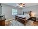 Cozy bedroom with wood flooring and a ceiling fan at 1036 Tompkins Dr, Port Orange, FL 32129