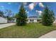House exterior showcasing a freshly cut lawn and landscaping at 1036 Tompkins Dr, Port Orange, FL 32129