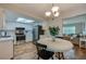 Eat-in kitchen features stainless steel appliances and a view of the living room at 1036 Tompkins Dr, Port Orange, FL 32129
