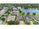 Neighborhood overview from above, showcasing homes and a lake at 1105 Gardenshire Ln, Deland, FL 32724