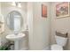 Small bathroom with pedestal sink and toilet at 1105 Gardenshire Ln, Deland, FL 32724