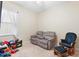 Relaxing bedroom with recliner and rocking chair at 1105 Gardenshire Ln, Deland, FL 32724