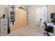 Bright bedroom with built-in shelves and a workspace at 1105 Gardenshire Ln, Deland, FL 32724