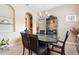 Formal dining room featuring a dark wood table and glass-top at 1105 Gardenshire Ln, Deland, FL 32724