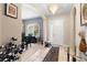 Elegant entryway with high ceilings, arched doorways, and a view into the dining room at 1105 Gardenshire Ln, Deland, FL 32724