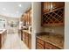 Well-equipped kitchen with granite countertops and wine rack at 1105 Gardenshire Ln, Deland, FL 32724