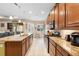Kitchen boasts granite countertops, ample cabinetry, and stainless steel appliances at 1105 Gardenshire Ln, Deland, FL 32724