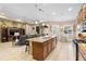 Spacious kitchen boasts an island, granite countertops, and ample cabinetry at 1105 Gardenshire Ln, Deland, FL 32724