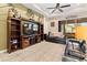 Comfortable living room with a built-in entertainment center and leather sofas at 1105 Gardenshire Ln, Deland, FL 32724