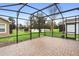 Spacious screened patio with brick pavers and pond views at 1105 Gardenshire Ln, Deland, FL 32724