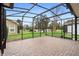 Relaxing screened patio overlooking a serene pond at 1105 Gardenshire Ln, Deland, FL 32724