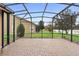 Large screened patio overlooking a pond at 1105 Gardenshire Ln, Deland, FL 32724
