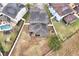 An aerial view of a house with a backyard, pool and neighboring houses at 1106 Woods Landing Dr, Minneola, FL 34715