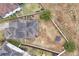 Aerial view showcasing the house and a large backyard with trampoline at 1106 Woods Landing Dr, Minneola, FL 34715