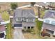 Aerial view of a two-story house with a gray roof and a landscaped yard at 1106 Woods Landing Dr, Minneola, FL 34715