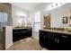 Elegant bathroom with double vanity, large mirror, and walk-in shower at 1106 Woods Landing Dr, Minneola, FL 34715
