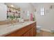 Clean bathroom with double sinks, granite countertop, and shower at 1106 Woods Landing Dr, Minneola, FL 34715