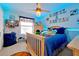Spacious bedroom with a basketball theme and a large bed at 1106 Woods Landing Dr, Minneola, FL 34715