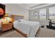 Comfortable bedroom with carpeted floors and ample natural light at 1106 Woods Landing Dr, Minneola, FL 34715