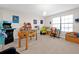 Playful game room, features arcade game, foosball table, and workspace at 1106 Woods Landing Dr, Minneola, FL 34715
