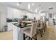 Modern kitchen featuring an island with seating and stainless steel appliances at 1106 Woods Landing Dr, Minneola, FL 34715