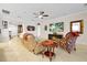 Spacious living room with a ceiling fan, large TV, and comfortable seating at 1106 Woods Landing Dr, Minneola, FL 34715