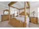 Main bedroom with ornate four-poster bed and ample space at 1106 Woods Landing Dr, Minneola, FL 34715