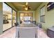 Covered patio with glass doors leading to the interior at 1106 Woods Landing Dr, Minneola, FL 34715