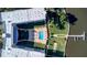 Top-down view of building, pool, and waterfront dock at 1224 S Peninsula Dr # 511, Daytona Beach, FL 32118