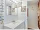 Clean bathroom with white vanity and framed artwork at 1224 S Peninsula Dr # 511, Daytona Beach, FL 32118
