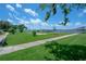 Landscaped lawn area with shuffleboard court and waterfront views at 1224 S Peninsula Dr # 511, Daytona Beach, FL 32118