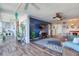 Open concept living room and dining area with hardwood floors and coastal decor at 1224 S Peninsula Dr # 511, Daytona Beach, FL 32118